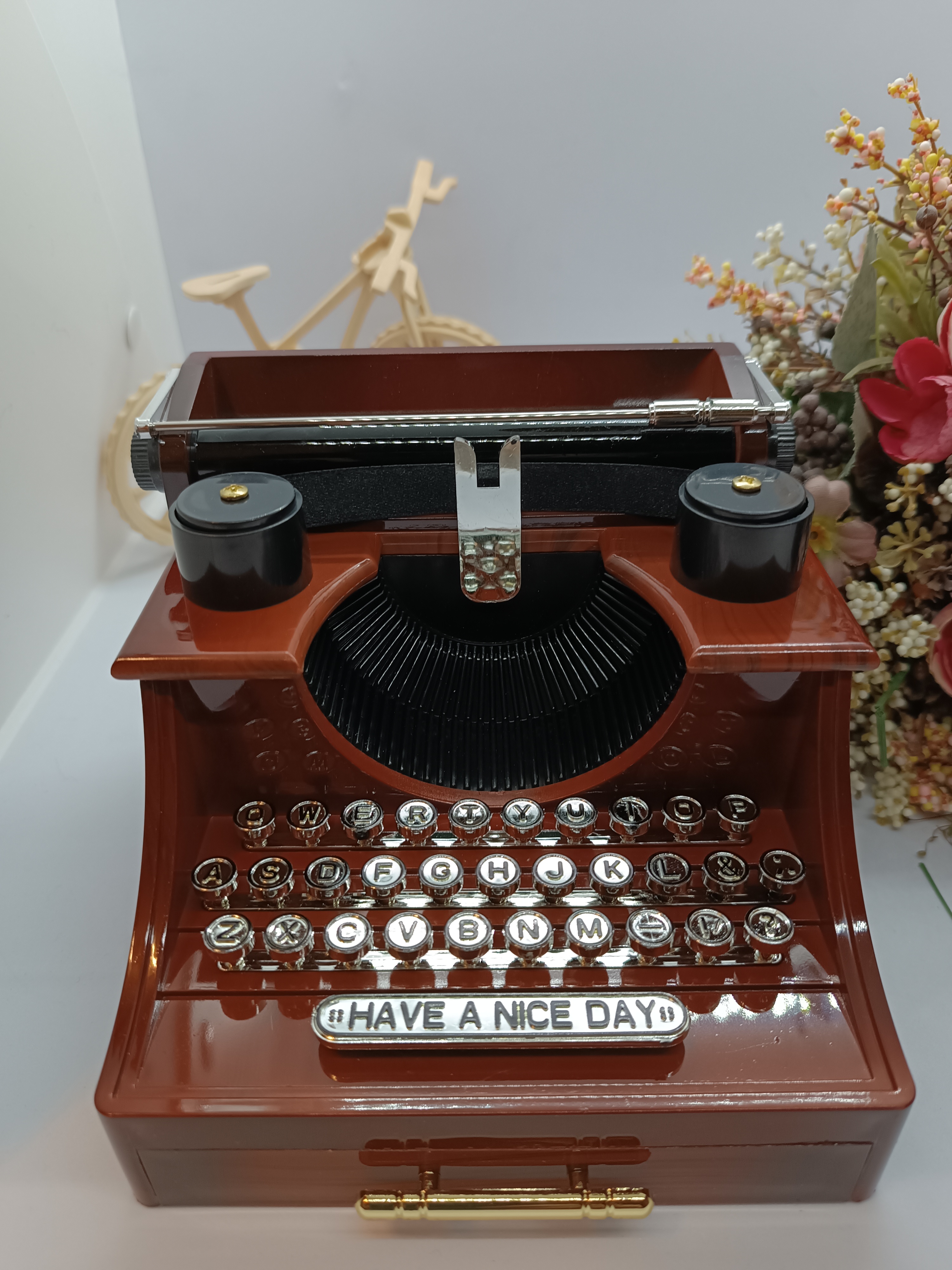Music box with typewriter figure.