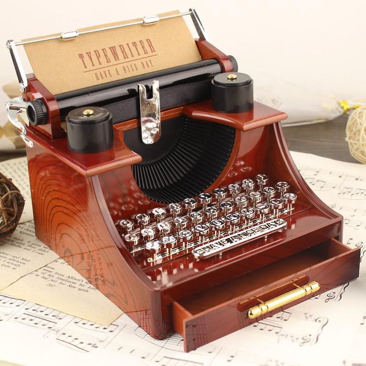 Music box with typewriter figure.