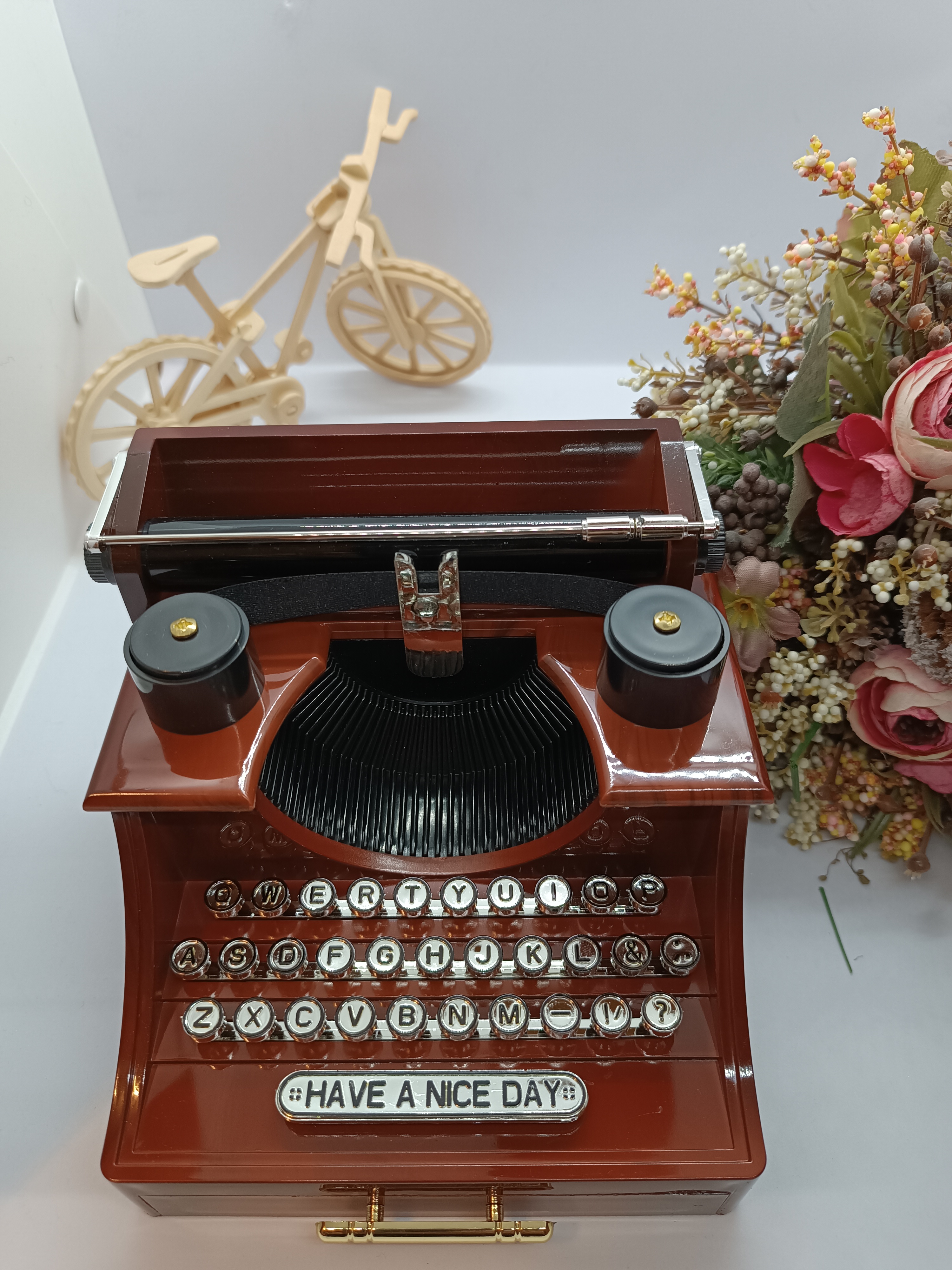 Music box with typewriter figure.