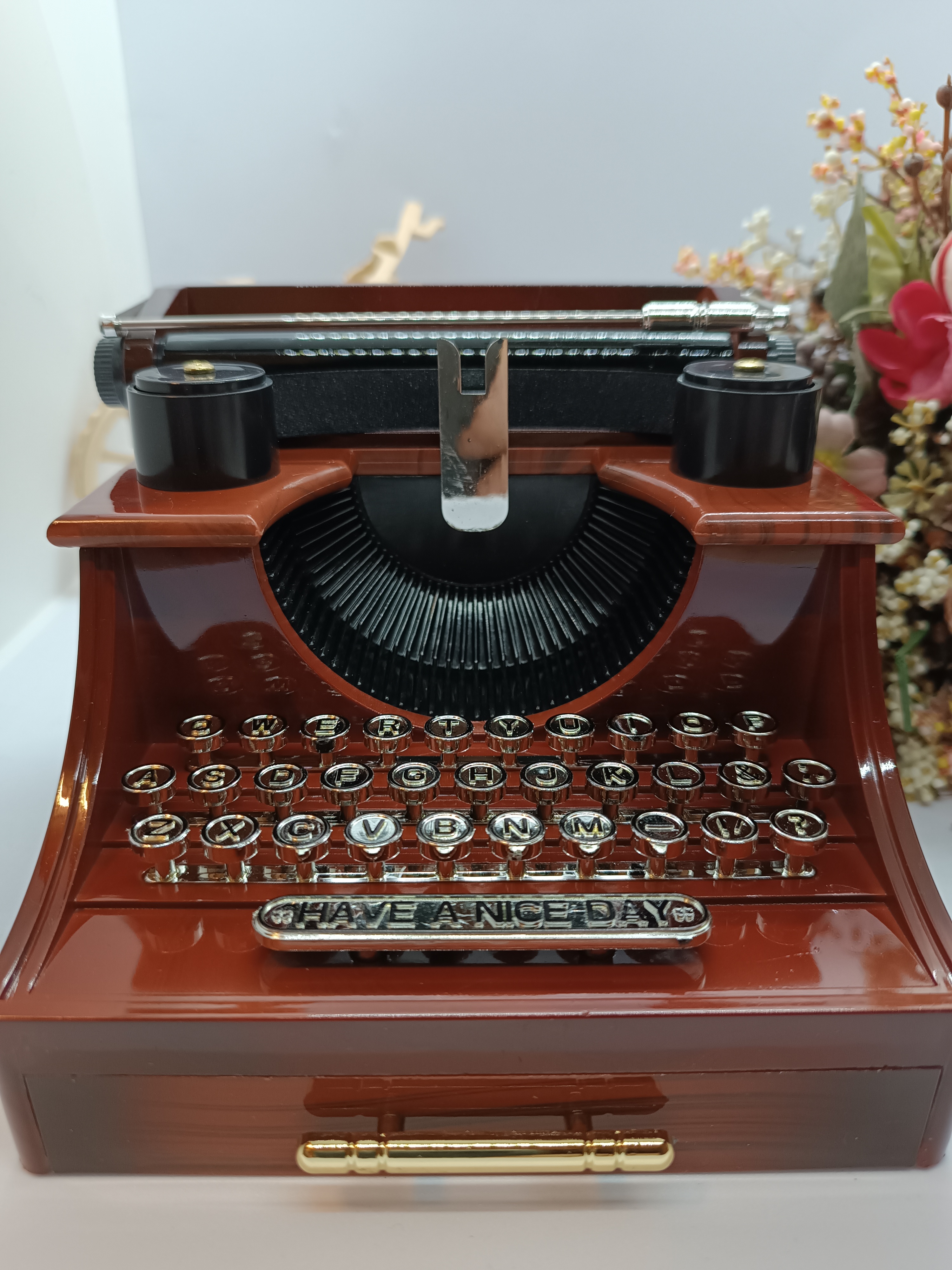 Music box with typewriter figure.